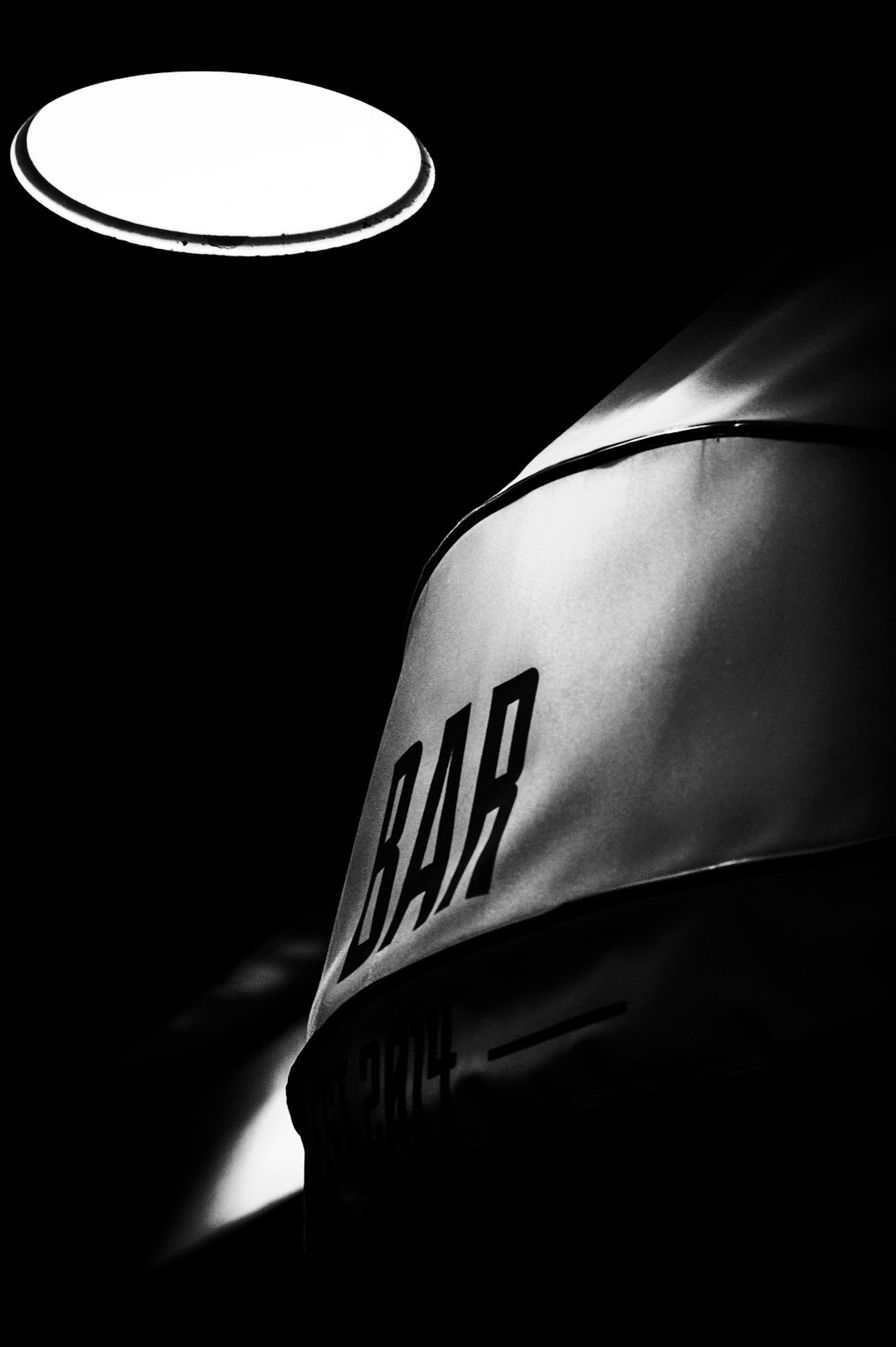 grayscale photo of bar sign